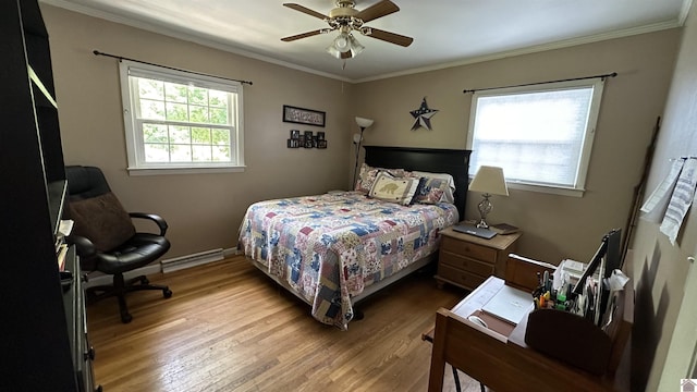 bedroom featuring ornamental molding, light hardwood / wood-style floors, ceiling fan, and baseboard heating