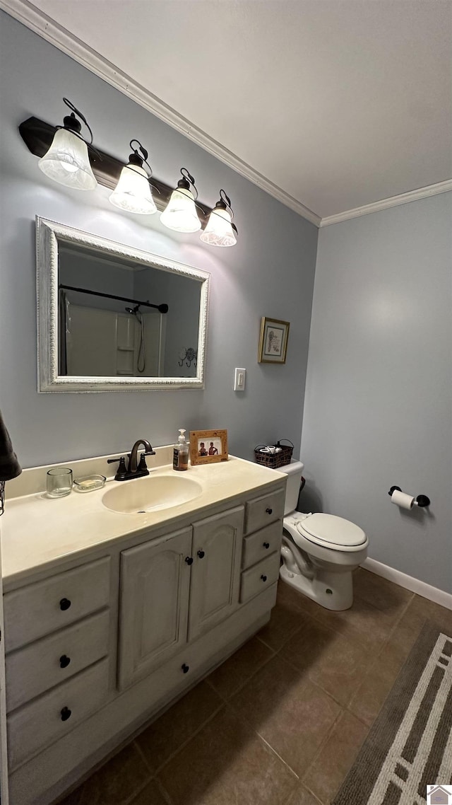 bathroom with ornamental molding, vanity, tile patterned floors, and toilet