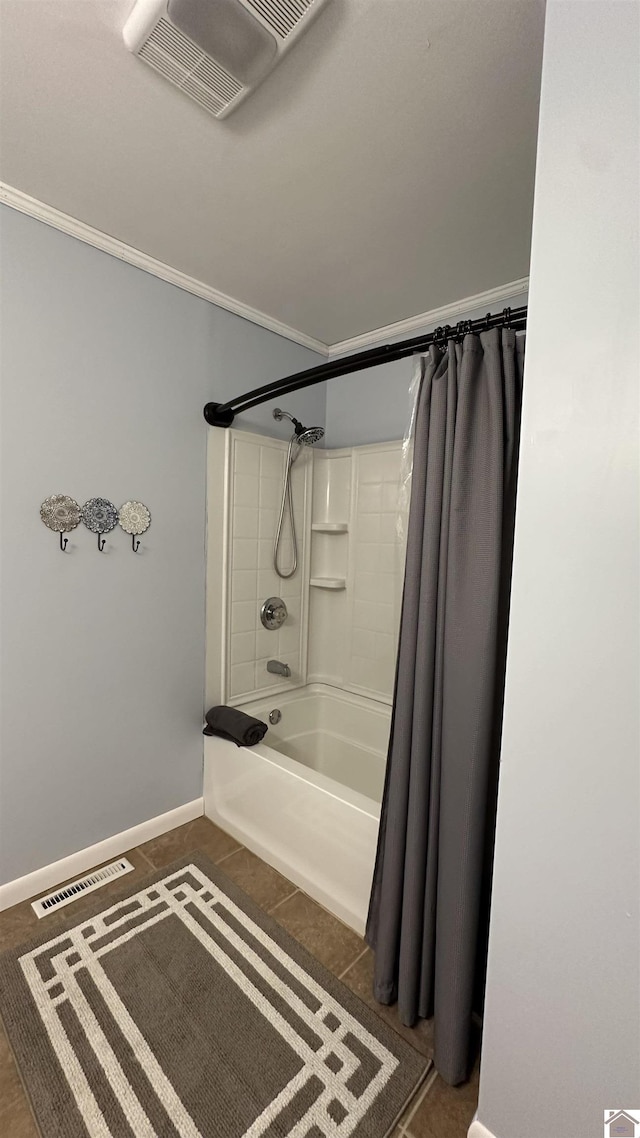 bathroom with shower / bath combo and tile patterned floors