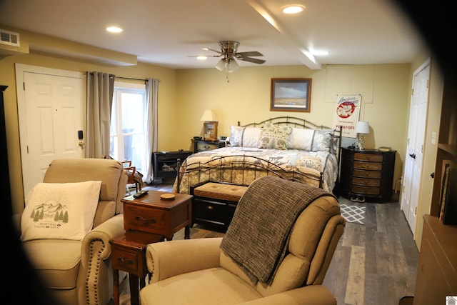 bedroom with dark hardwood / wood-style floors