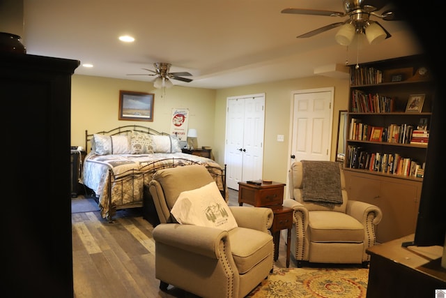 bedroom with hardwood / wood-style flooring and ceiling fan