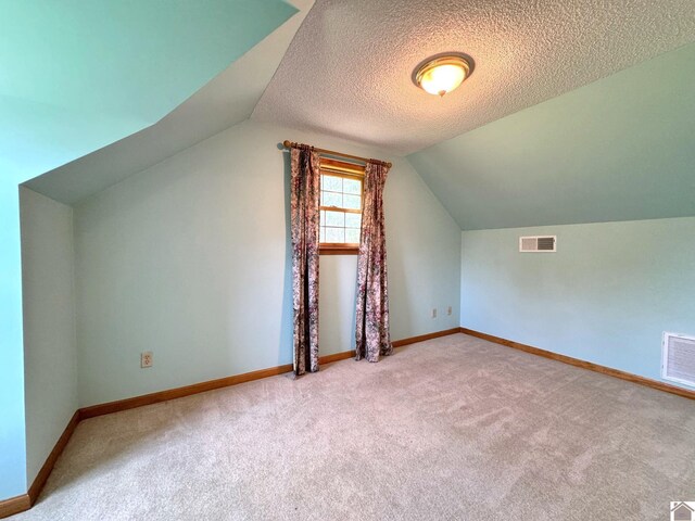 spacious closet featuring light carpet