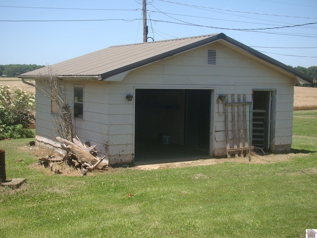 view of outdoor structure with a yard