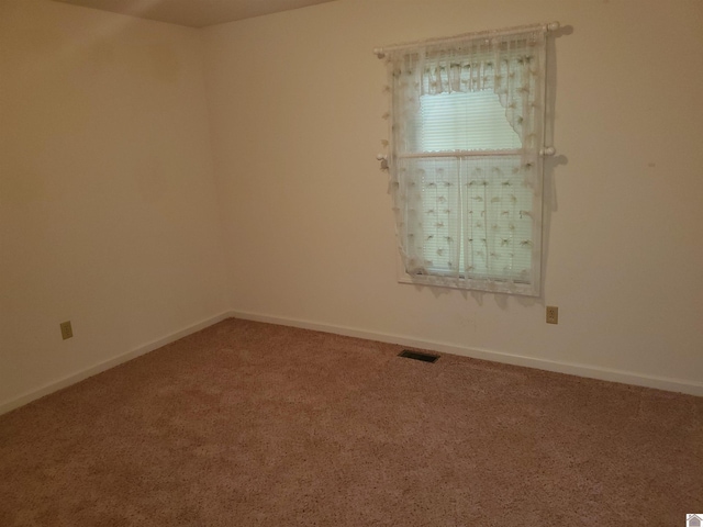 unfurnished room featuring carpet flooring