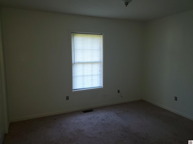 unfurnished room featuring carpet floors