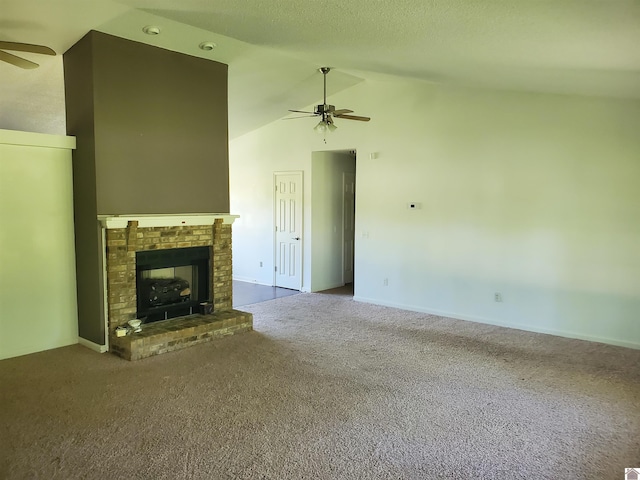 unfurnished living room with ceiling fan, a fireplace, high vaulted ceiling, and carpet