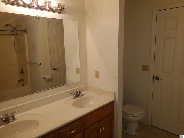 full bathroom featuring tile patterned flooring, vanity, shower / tub combination, and toilet