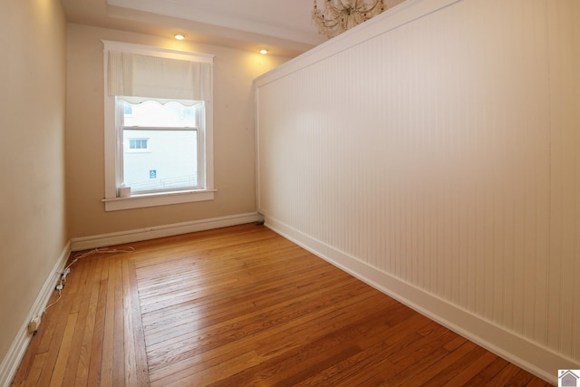 empty room with hardwood / wood-style floors