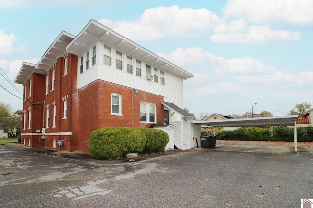 view of home's exterior with a carport