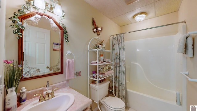 full bathroom featuring vanity, shower / tub combo, and toilet