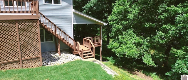 exterior space featuring a yard and a wooden deck