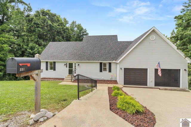 view of front facade with a garage and a front yard