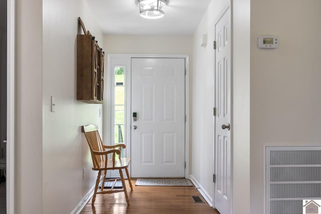 entryway with dark hardwood / wood-style floors