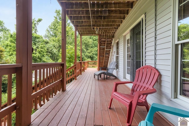 wooden terrace featuring covered porch