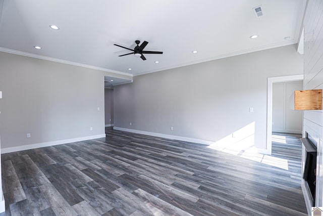 unfurnished living room with ornamental molding, ceiling fan, and dark wood-type flooring