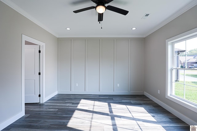 spare room featuring visible vents, crown molding, and plenty of natural light