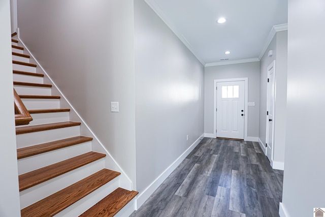 entrance foyer featuring dark hardwood / wood-style flooring and ornamental molding