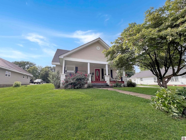 view of front facade featuring a front yard and covered porch