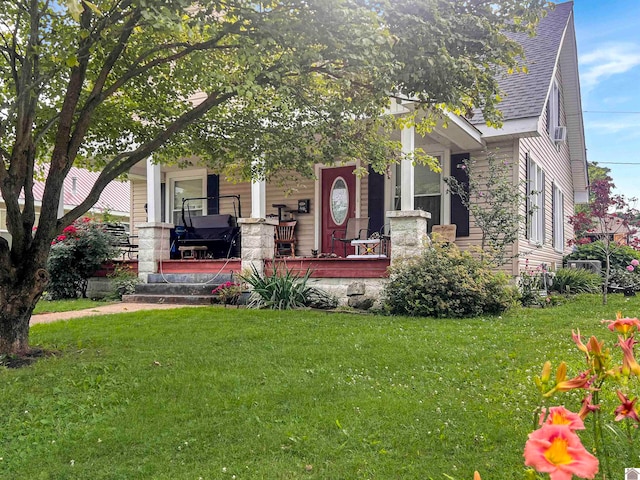 view of front of home with a front lawn and a porch