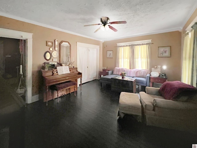 living room with a textured ceiling, ceiling fan, and crown molding