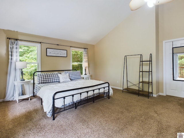 carpeted bedroom with high vaulted ceiling and ceiling fan