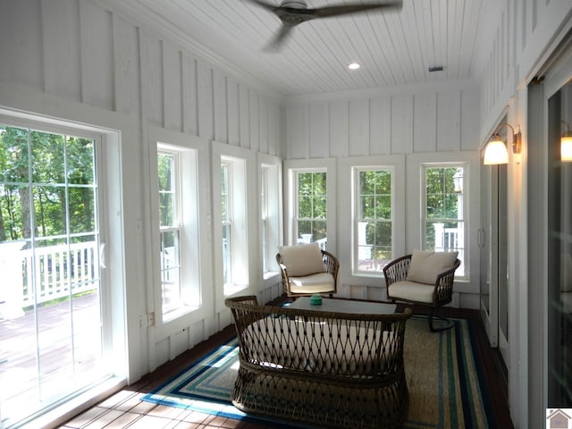 sunroom featuring ceiling fan