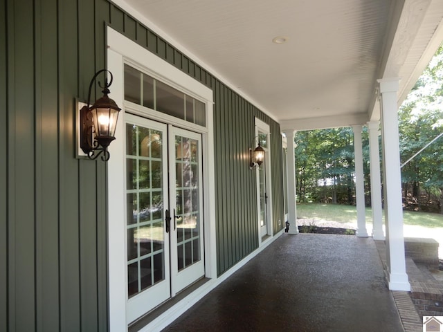 view of patio with french doors and a porch