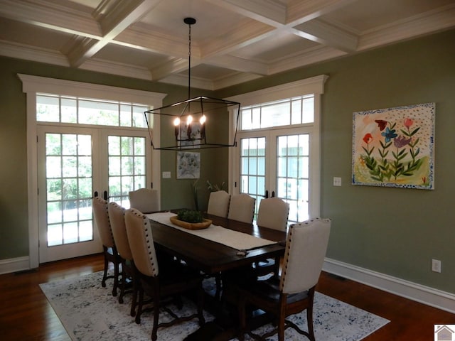 dining space featuring french doors, dark hardwood / wood-style floors, and crown molding