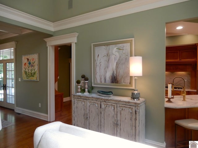 bedroom with ornamental molding, dark hardwood / wood-style flooring, french doors, and sink