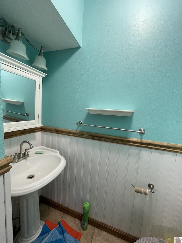 bathroom with tile patterned flooring and sink