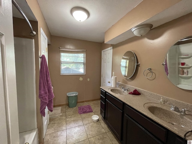 bathroom with tile patterned floors and vanity