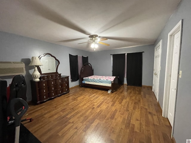 bedroom with ceiling fan and light hardwood / wood-style flooring