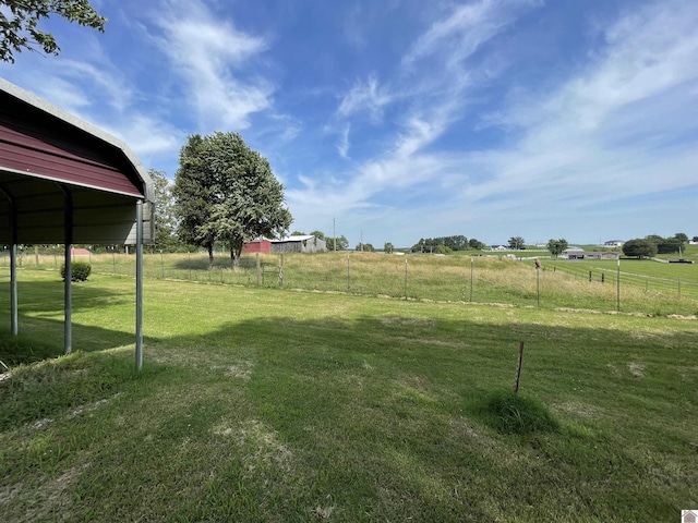 view of yard with a rural view