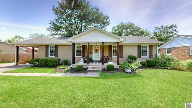 ranch-style home with covered porch and a front yard