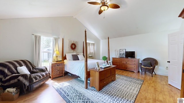 bedroom featuring vaulted ceiling with beams, ceiling fan, and light hardwood / wood-style floors