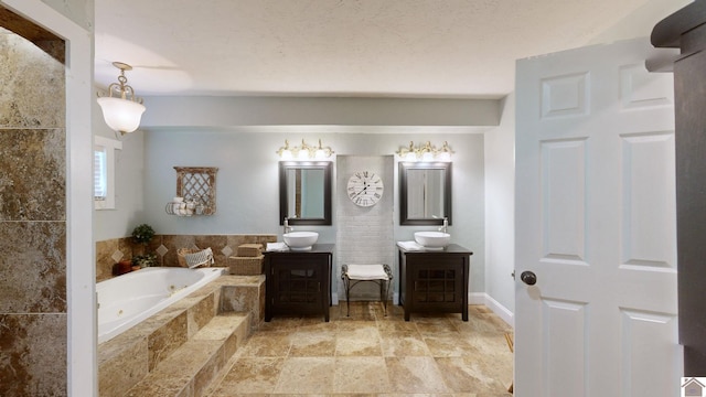 bathroom with vanity and tiled bath