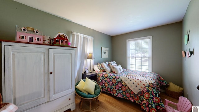 bedroom with wood-type flooring