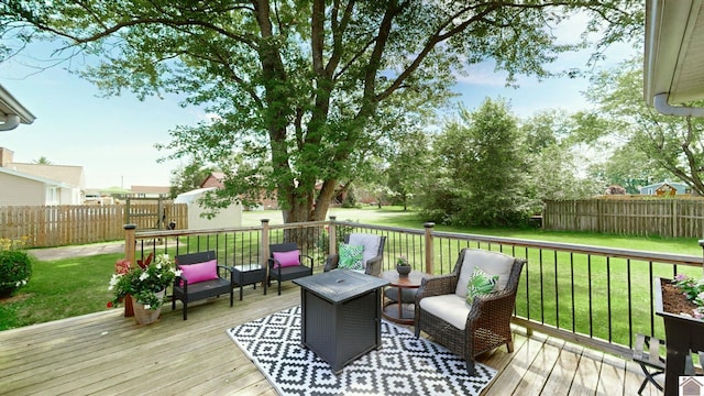 wooden terrace featuring a yard