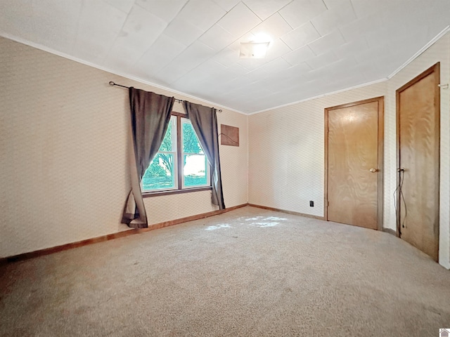 unfurnished bedroom featuring carpet flooring and crown molding