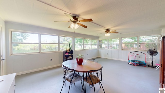 sunroom / solarium featuring ceiling fan