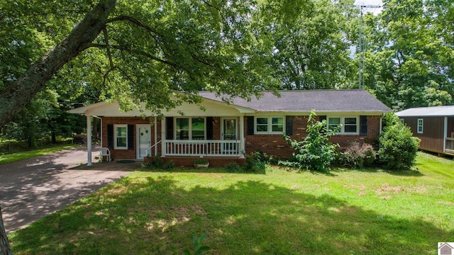 ranch-style house with a front yard and a porch