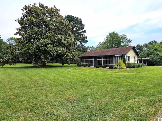 view of yard with a sunroom