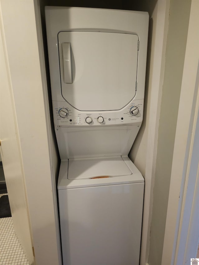 laundry area with stacked washer and clothes dryer