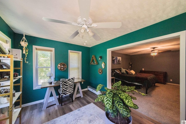 interior space featuring dark wood-type flooring and ceiling fan