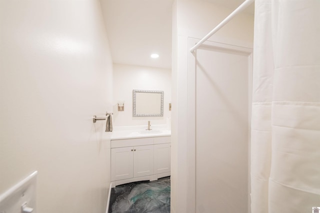 bathroom featuring vanity and curtained shower