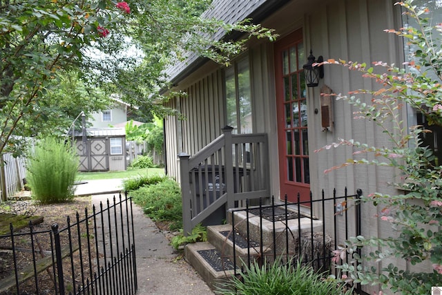 view of side of home featuring a storage unit