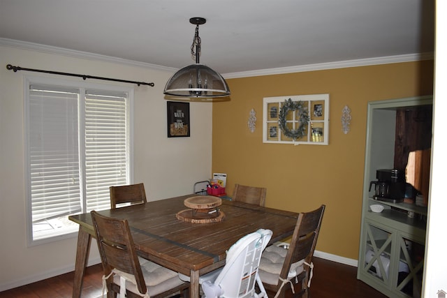 dining room featuring ornamental molding, plenty of natural light, and dark wood-type flooring