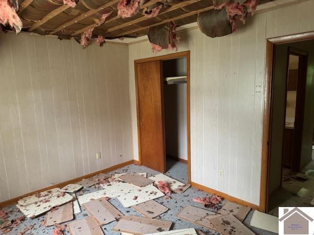 360 Boyds Landing Rd, Canton, KY 42211 - unfurnished bedroom featuring baseboards and wooden walls