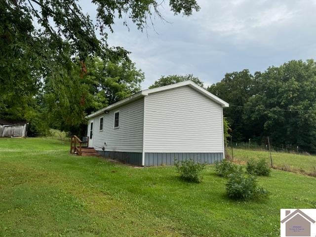 view of home's exterior featuring a yard