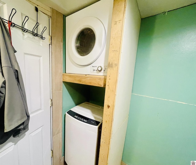 clothes washing area with stacked washer / drying machine